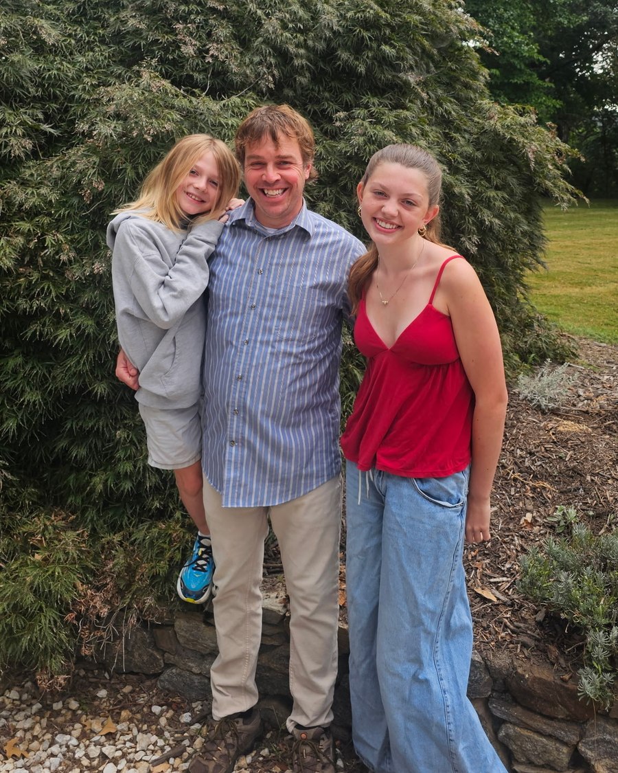 Daniel Shetley with his two children in the garden